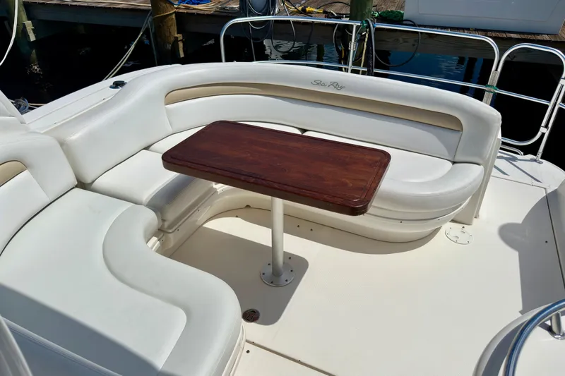 Lonie Marie Yacht Photos Pics Luxurious seating area on a 2008 Sea Ray 340 Sundancer yacht with wooden table.