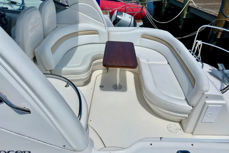 Lonie Marie Yacht Photos Pics 2008 Sea Ray 340 Sundancer boat with white seating and wooden table on deck.