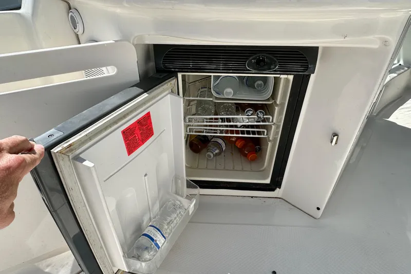 Lonie Marie Yacht Photos Pics Mini fridge on 2008 Sea Ray 340 Sundancer yacht, stocked with drinks.