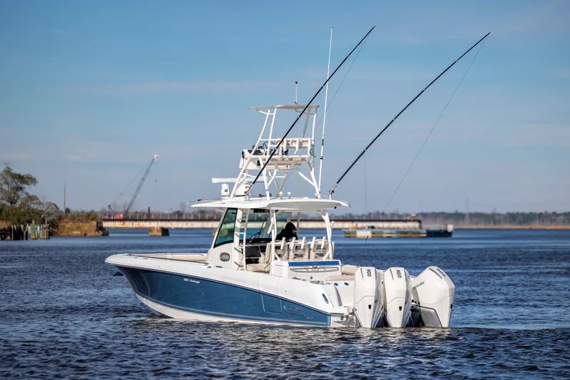  Yacht Photos Pics 2019 Boston Whaler 350 Outrage boat with triple engines on calm water.