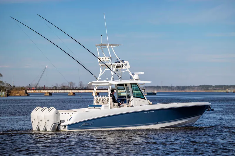  Yacht Photos Pics 2019 Boston Whaler 350 Outrage boat cruising on a calm river.