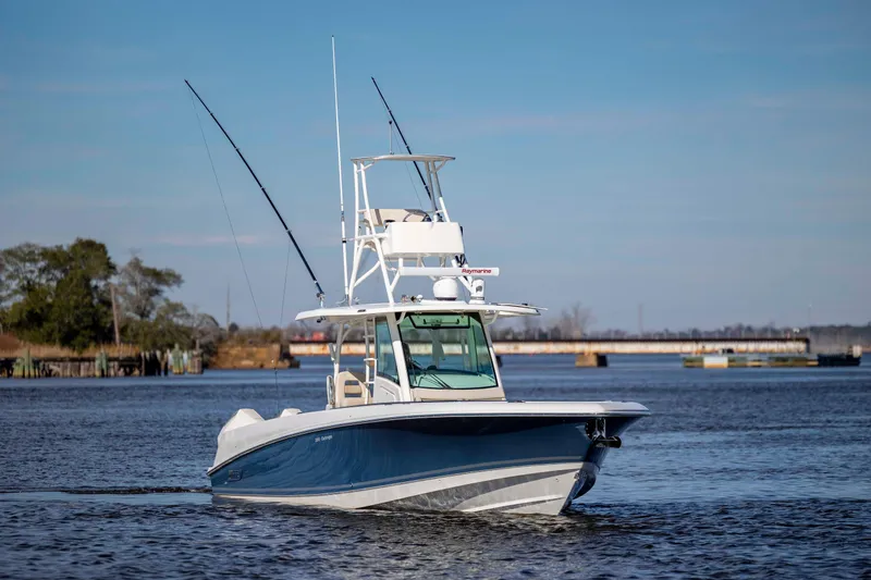  Yacht Photos Pics 2019 Boston Whaler 350 Outrage boat cruising on calm waters.