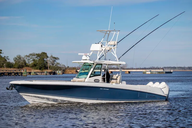  Yacht Photos Pics 2019 Boston Whaler 350 Outrage boat cruising on a calm river.