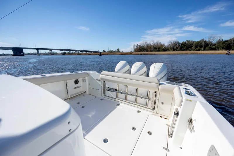  Yacht Photos Pics 2019 Boston Whaler 350 Outrage boat with triple Mercury engines on a sunny day.