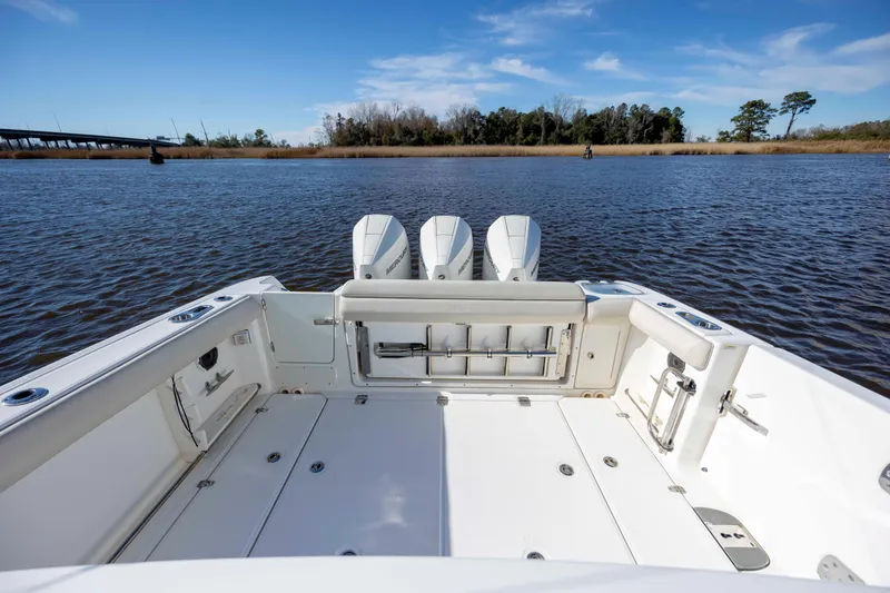  Yacht Photos Pics 2019 Boston Whaler 350 Outrage boat with triple Mercury engines on calm water.