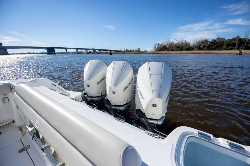  Yacht Photos Pics 2019 Boston Whaler 350 Outrage with triple Mercury engines on a sunny day.