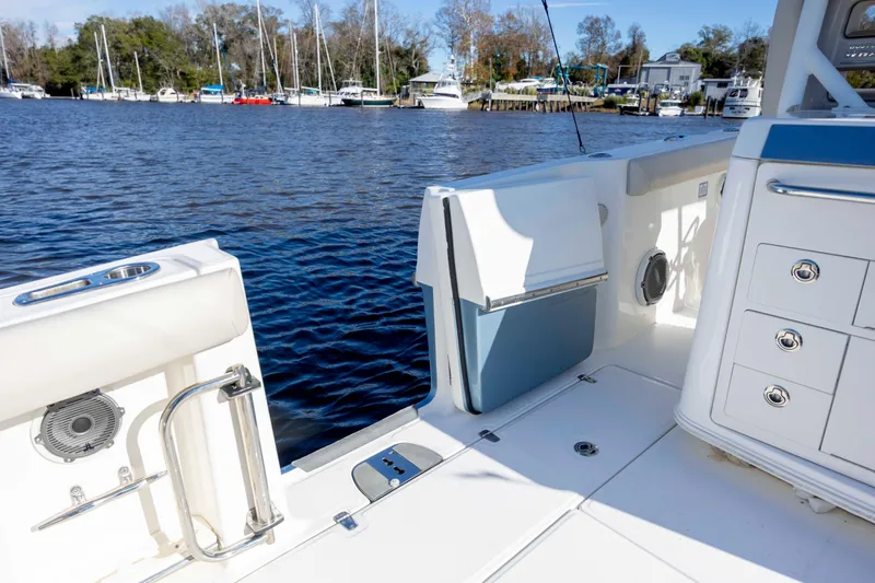  Yacht Photos Pics 2019 Boston Whaler 350 Outrage boat interior with open water view and docked sailboats.