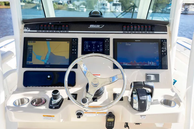  Yacht Photos Pics 2019 Boston Whaler 350 Outrage helm with advanced navigation displays and controls.