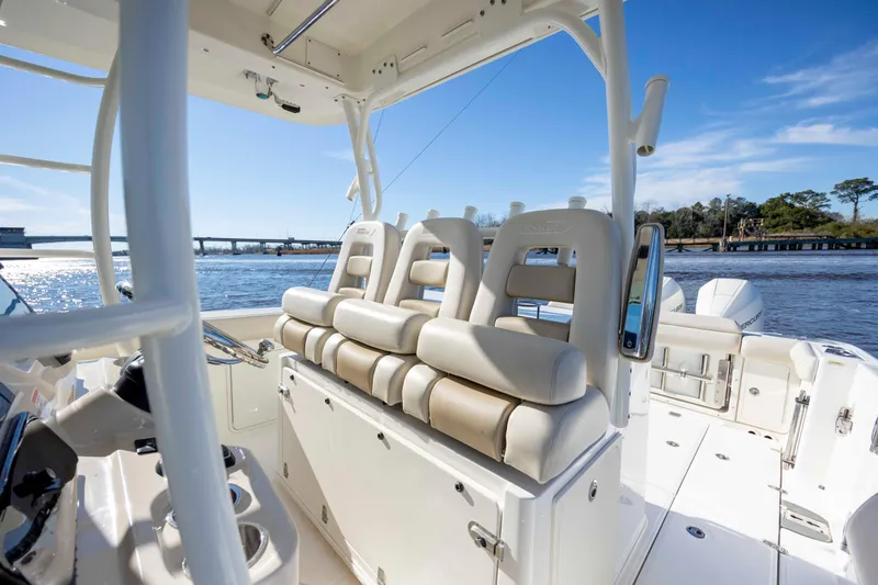  Yacht Photos Pics 2019 Boston Whaler 350 Outrage boat interior with luxurious seating and scenic water view.