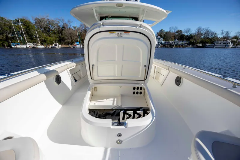 Yacht Photos Pics 2019 Boston Whaler 350 Outrage boat with open storage compartment on deck.