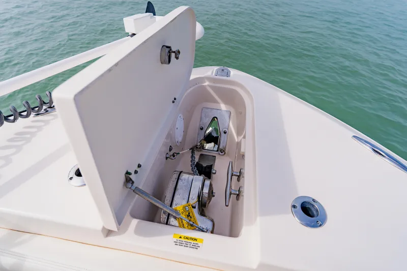  Yacht Photos Pics Open anchor locker on 2021 Grady-White Canyon 306 boat, showing anchor chain and mechanism.