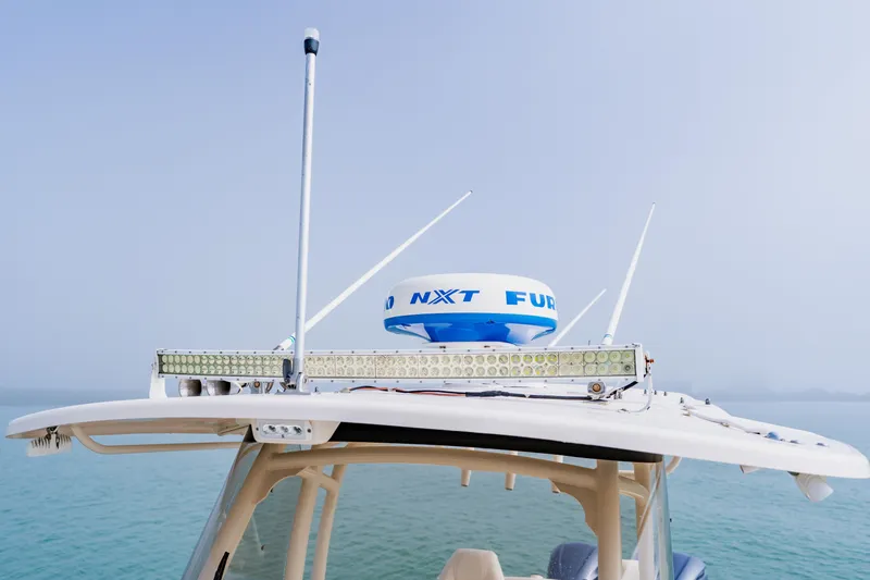  Yacht Photos Pics 2021 Grady-White Canyon 306 boat with radar and antennas on the roof.