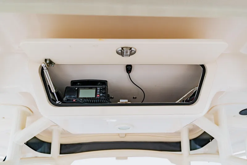  Yacht Photos Pics 2021 Grady-White Canyon 306 boat storage compartment with electronic equipment.