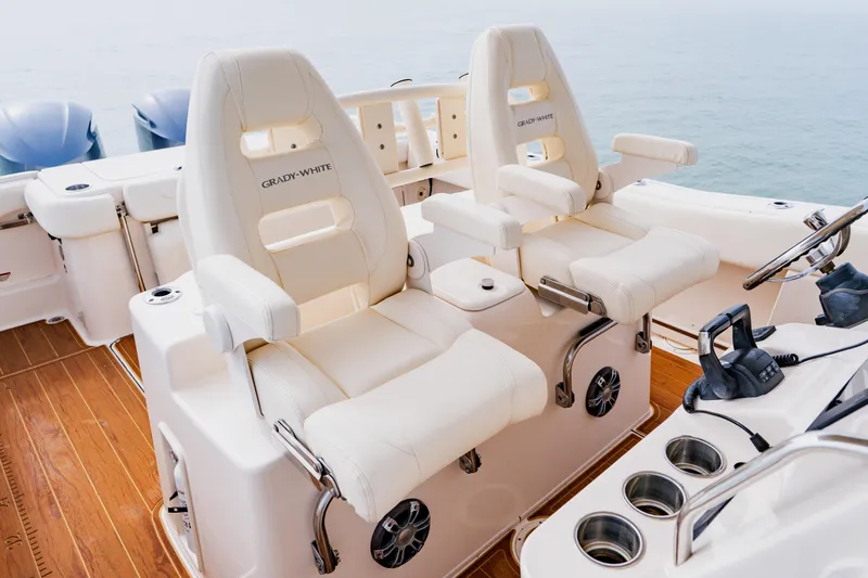  Yacht Photos Pics 2021 Grady-White Canyon 306 boat interior with luxurious seating and helm controls.
