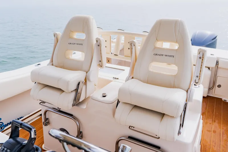  Yacht Photos Pics 2021 Grady-White Canyon 306 boat seats, luxurious design, ocean backdrop.