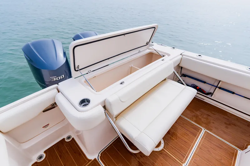  Yacht Photos Pics 2021 Grady-White Canyon 306 boat with open storage and Yamaha 300 engines on water.