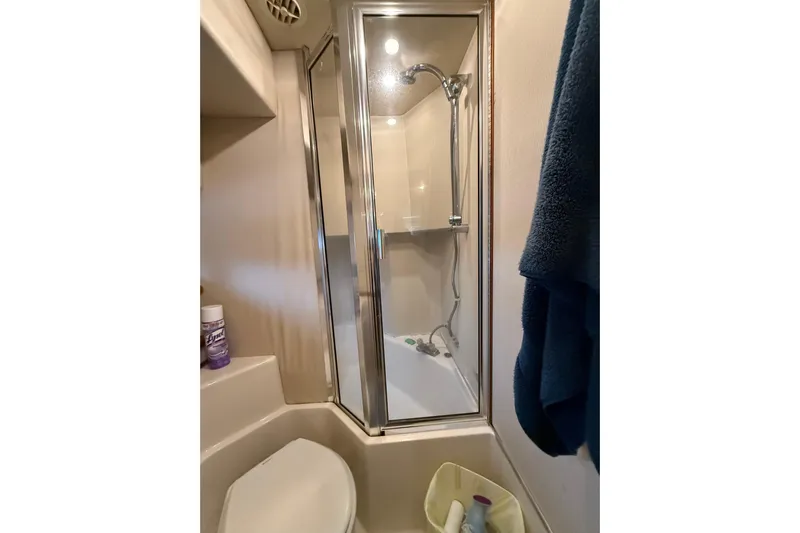 At Ease Yacht Photos Pics Bathroom of 1997 Bayliner 47 Motoryacht with shower and toilet.