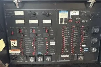 At Ease Yacht Photos Pics Electrical control panel of 1997 Bayliner 47 Motoryacht with switches and gauges.