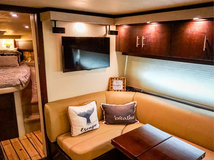 Crescendo II Yacht Photos Pics Luxurious interior of 2015 Regal 42 Sport Coupe with cozy seating and modern decor.