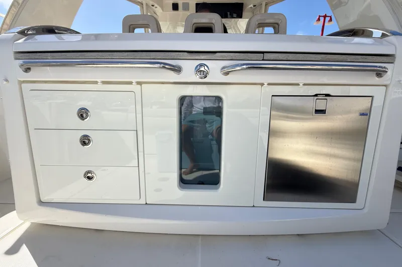  Yacht Photos Pics 2017 Boston Whaler 420 Outrage boat interior with storage compartments and stainless steel features.
