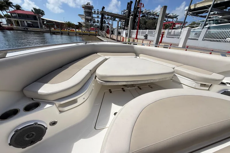  Yacht Photos Pics 2017 Boston Whaler 420 Outrage boat interior with cushioned seating and cup holders.
