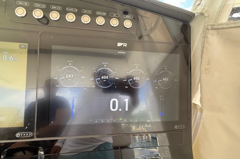  Yacht Photos Pics Dashboard of a 2017 Boston Whaler 420 Outrage showing engine data and depth.