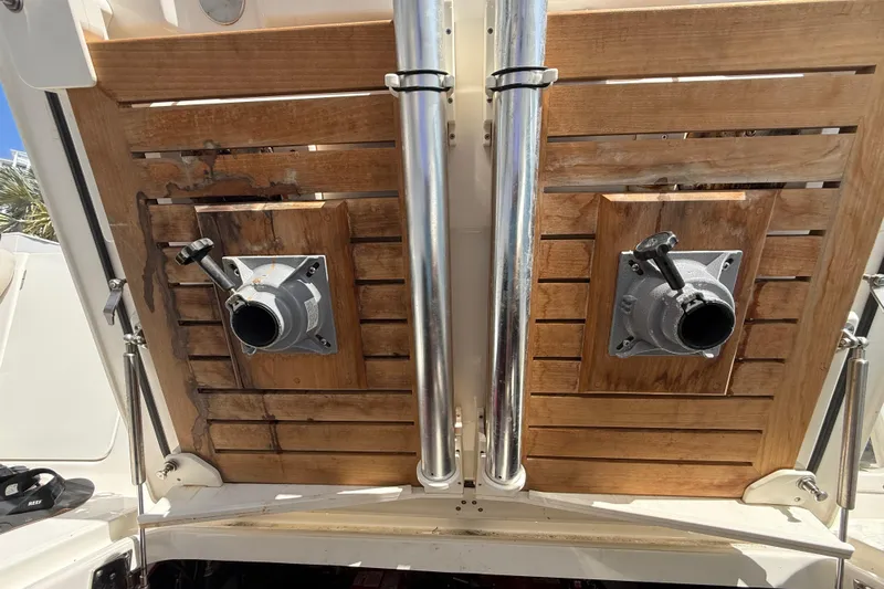  Yacht Photos Pics 2017 Boston Whaler 420 Outrage boat deck with wooden panels and metal fixtures.