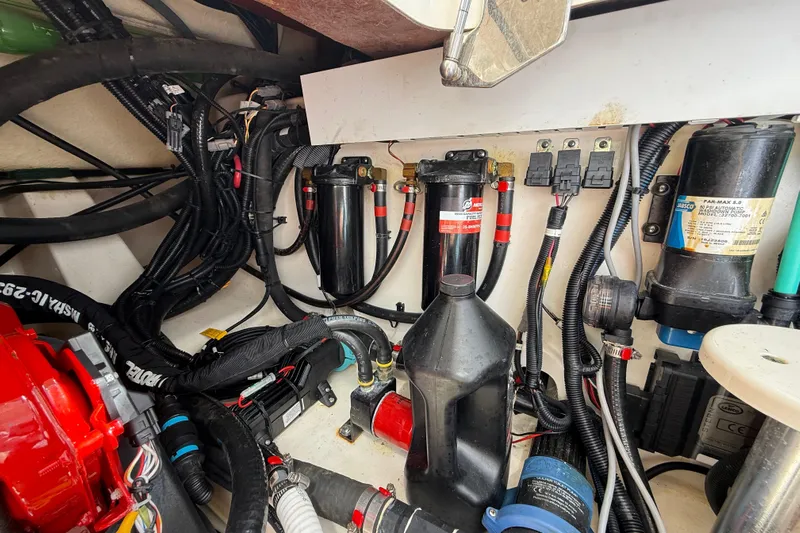  Yacht Photos Pics Engine compartment of a 2017 Boston Whaler 420 Outrage with various mechanical components.
