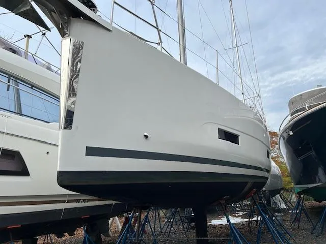Sirene Yacht Photos Pics Dufour 390 GL 2019 sailboat on stands, side view, in a boatyard.