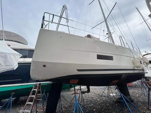 Sirene Yacht Photos Pics Dufour 390 GL 2019 sailboat on stands in a boatyard, side view.
