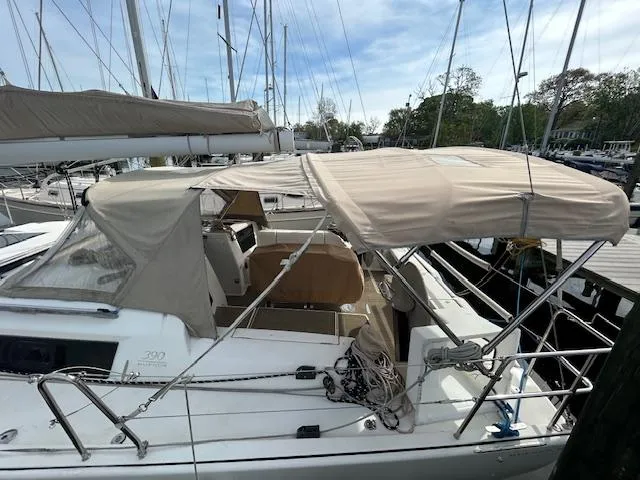 Sirene Yacht Photos Pics 2019 Dufour 390 GL sailboat docked with beige canopy and ropes.