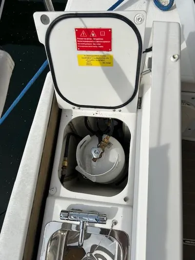 Sirene Yacht Photos Pics Dufour 390 GL 2019 yacht gas compartment with safety labels and fittings.