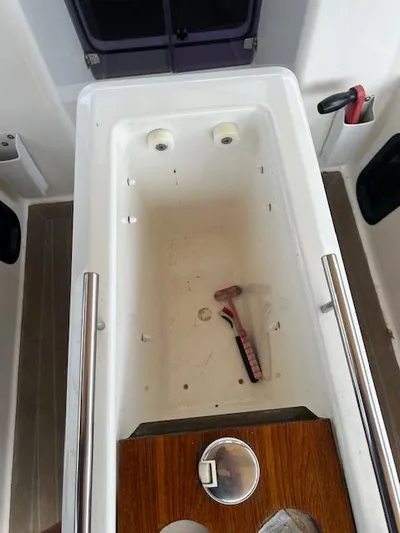Sirene Yacht Photos Pics Dufour 390 GL 2019 yacht cockpit storage with a razor inside.