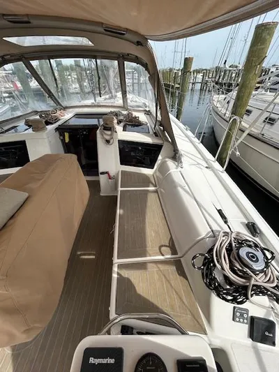 Sirene Yacht Photos Pics 2019 Dufour 390 GL sailboat cockpit with navigation equipment and marina view.
