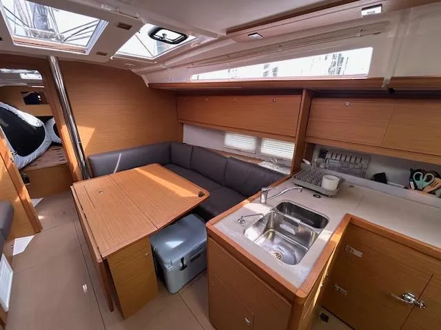 Sirene Yacht Photos Pics Interior of 2019 Dufour 390 GL yacht with modern kitchen and cozy seating area.