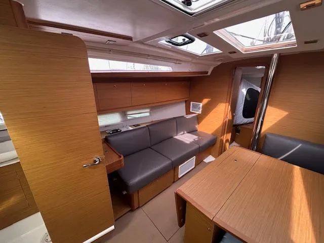 Sirene Yacht Photos Pics Interior of 2019 Dufour 390 GL yacht with wooden finish and comfortable seating.