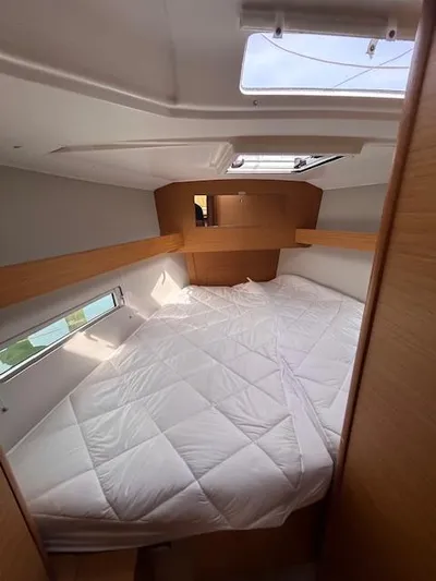 Sirene Yacht Photos Pics Cozy cabin interior of 2019 Dufour 390 GL yacht with natural light.