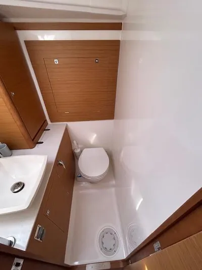 Sirene Yacht Photos Pics Bathroom interior of a 2019 Dufour 390 GL yacht, featuring a compact design.