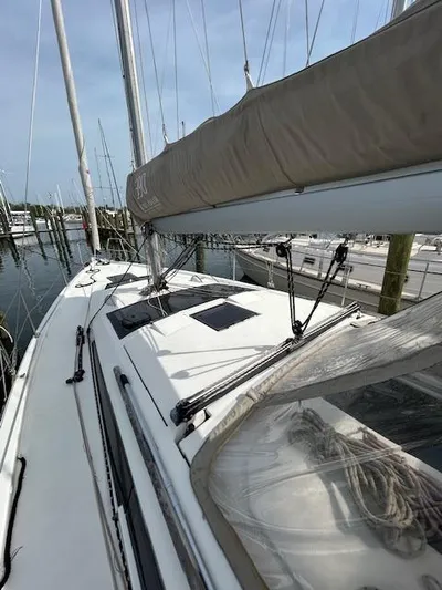 Sirene Yacht Photos Pics 2019 Dufour 390 GL sailboat docked at marina, showcasing deck and rigging.