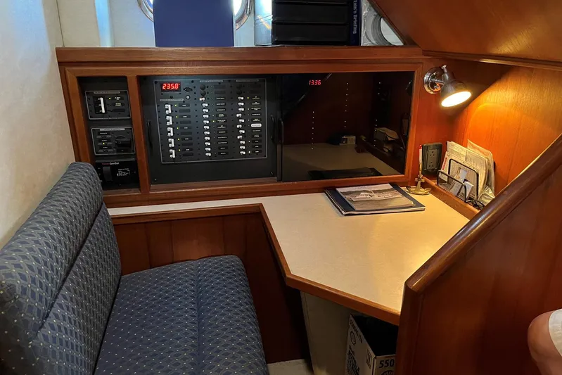 Dinky Dau Yacht Photos Pics 2007 Nordic Tug 42 interior with control panel, desk, and seating area.
