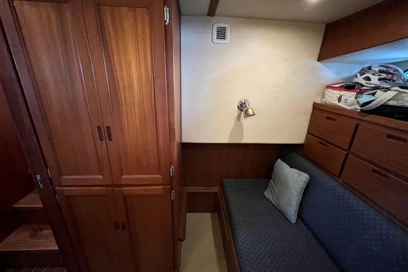 Dinky Dau Yacht Photos Pics Cozy cabin interior of 2007 Nordic Tug 42 with wooden cabinetry and seating area.
