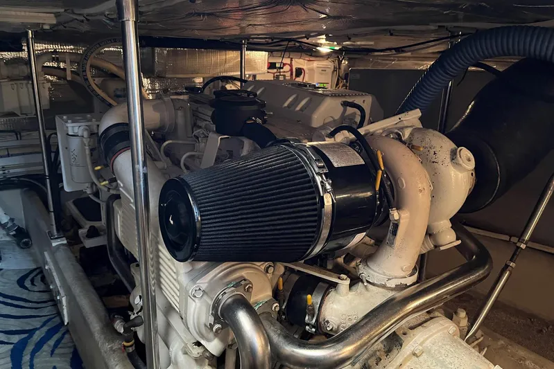 Dinky Dau Yacht Photos Pics Engine room of a 2007 Nordic Tug 42, showcasing detailed mechanical components.