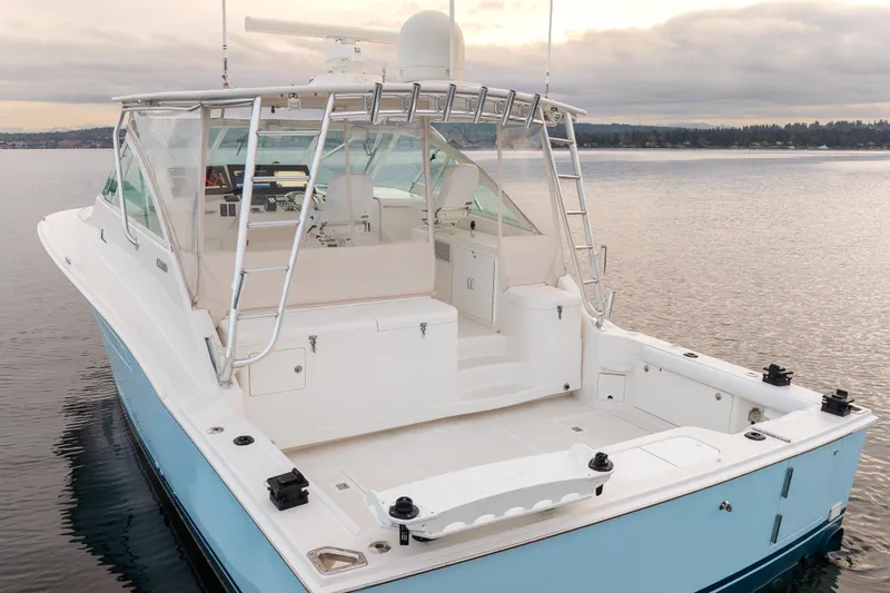  Yacht Photos Pics 2006 Cabo 40 Express boat on calm water, featuring spacious deck and sleek design.
