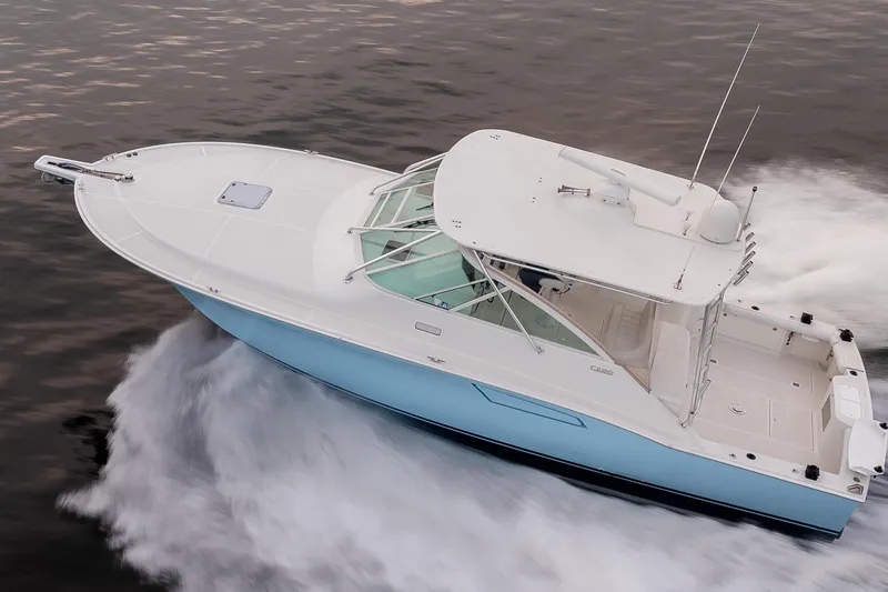  Yacht Photos Pics 2006 Cabo 40 Express boat cruising on water, aerial view.