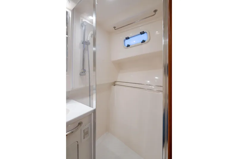  Yacht Photos Pics Compact shower area in 2006 Cabo 40 Express yacht bathroom.