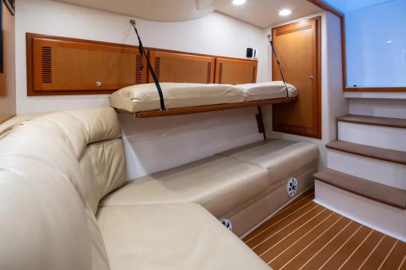  Yacht Photos Pics Interior of 2006 Cabo 40 Express yacht with beige seating and wooden accents.