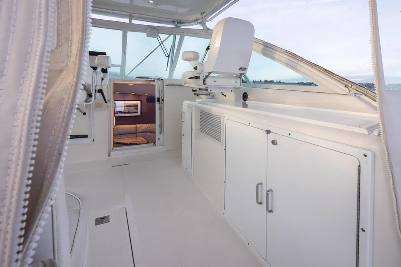  Yacht Photos Pics 2006 Cabo 40 Express yacht interior with white seating and cabinetry.