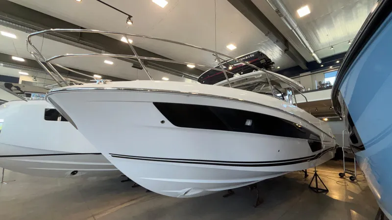  Yacht Photos Pics 2024 Jeanneau Leader 12.5 WA boat displayed indoors, showcasing sleek design and modern features.