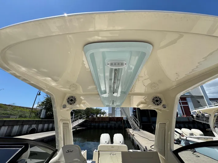  Yacht Photos Pics 2025 Scout 277 Dorado boat interior with speakers and overhead lighting.