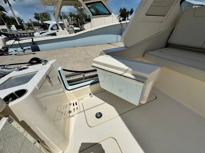  Yacht Photos Pics 2025 Scout 277 Dorado boat interior with seating and storage features.